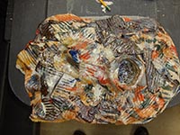 wall hanging with orange, brown, and some blue wall hanging with orange, brown, and some blue